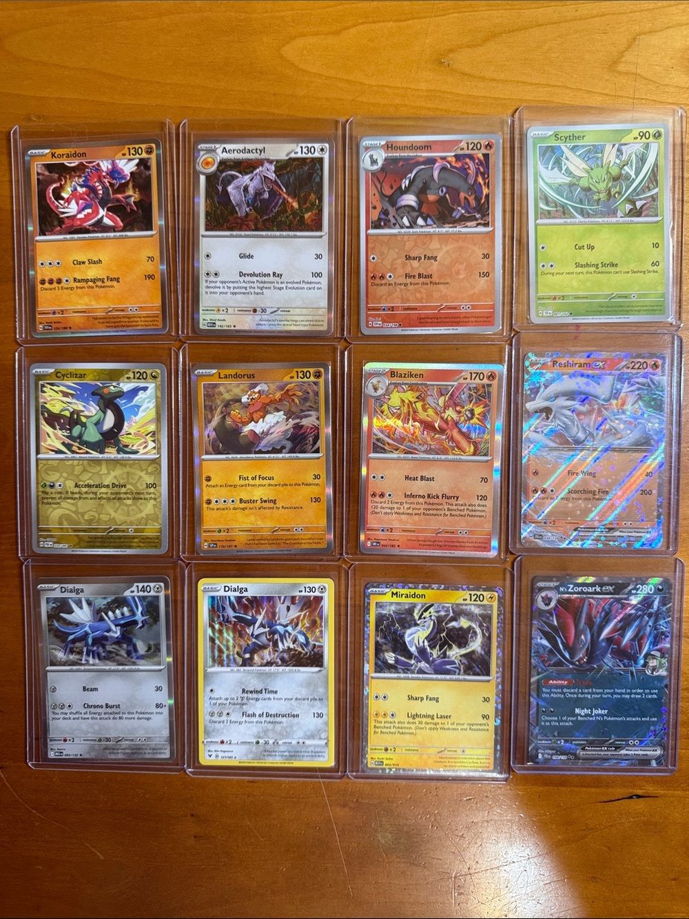 Pokemon Assorted Holo Card Lot - Red, Orange, Yellow, Green, Blue, Black